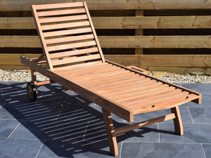 classic teak wood outdoor sunlounger with wheels