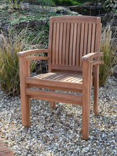 Load image into Gallery viewer, Detail of 2 teak garden armchairs stacked together, suitable for commercial use