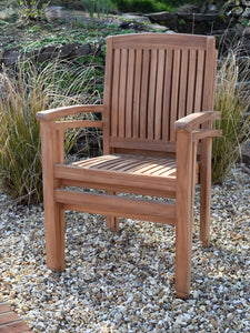 Detail of 2 teak garden armchairs stacked together, suitable for commercial use
