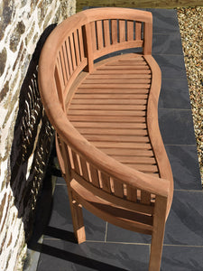 Detail of seat slats on curved teak banana bench, running front to back