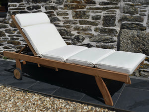 Traditional teak wood outdoor sun lounger with classic natural ecru colour cushion