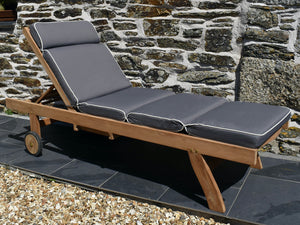 Classic teak garden sun lounger with luxury dove grey cushion featuring contrast white piping