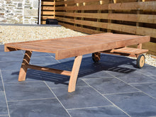 Load image into Gallery viewer, Solid teak outdoor sun lounger laid flat with pull-out side table