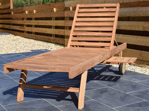 traditional teak garden sunlounger with pull-out side table